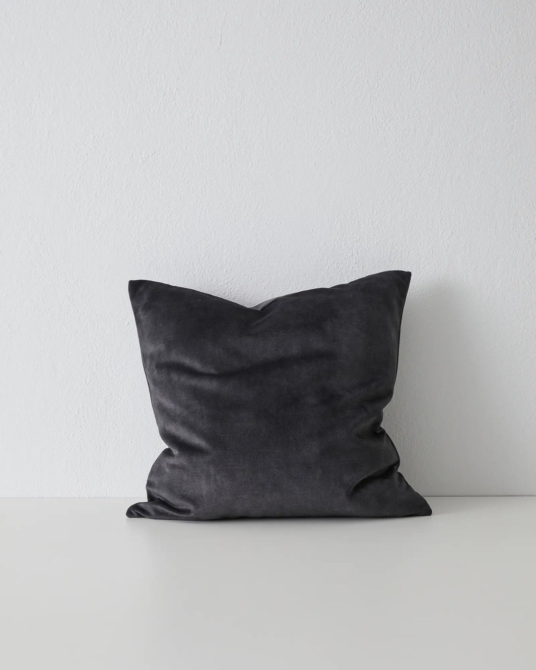 Ava Coal cushion, 50x50cm, charcoal polyester with soft velvet texture and relaxed slouch styling by Weave Home