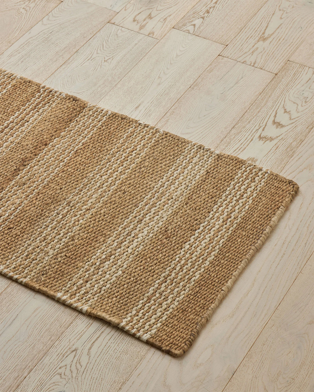 Arden Natural hand-woven jute door mat with irregular striped weave in ecru and sand tones, 65cm x 120cm by Weave Home