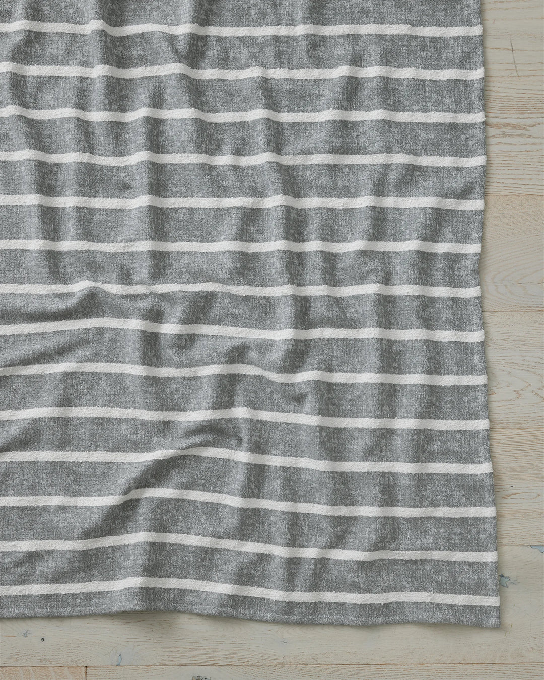 Piazza Mineral woven cotton blend throw with textural bouclé stripe detail, charcoal and cream by Weave Home