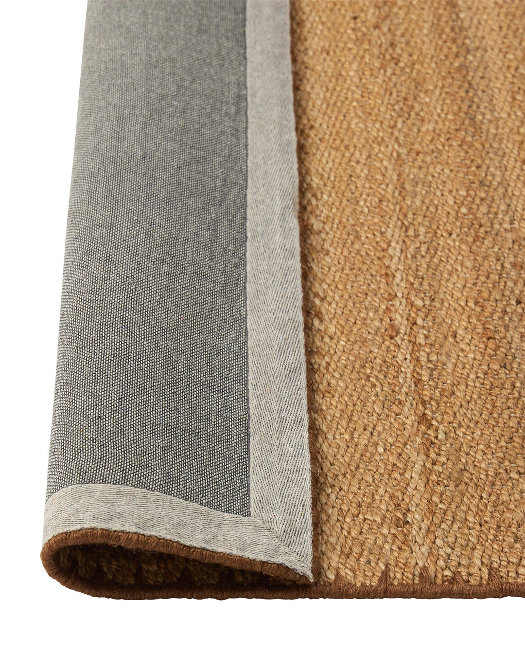 Monroe Biscuit rug detail, woven polyester high-traffic rug with blanket stitch border in warm golden sandy neutral, by Weave Home
