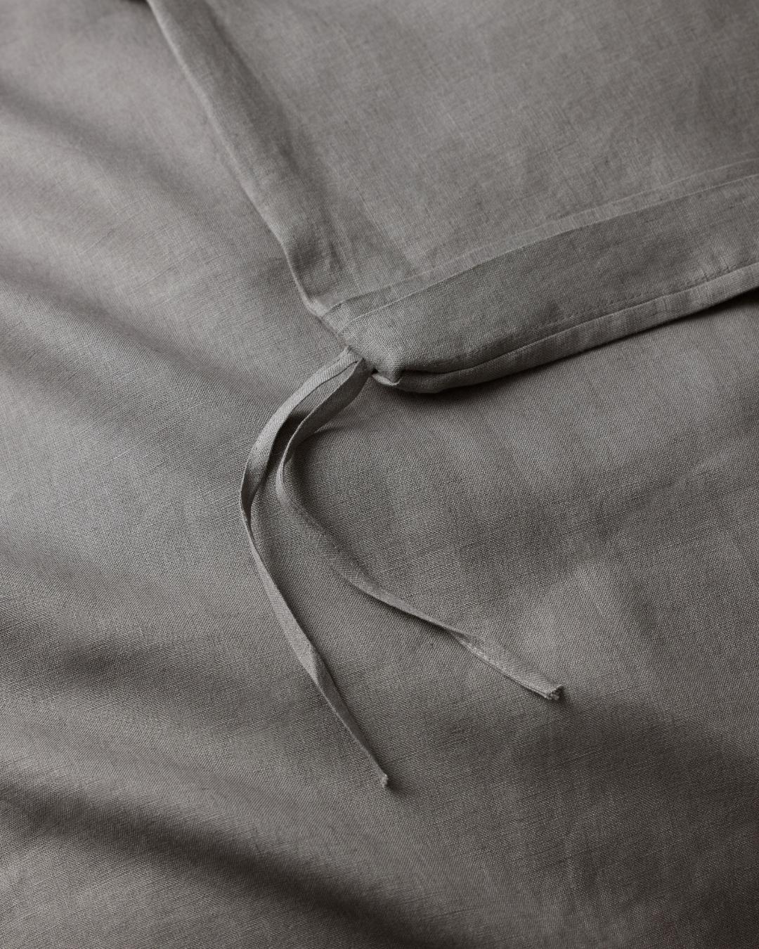 Ravello Quilt Cover in charcoal, close-up of internal linen ties detail securing quilt by Weave Home