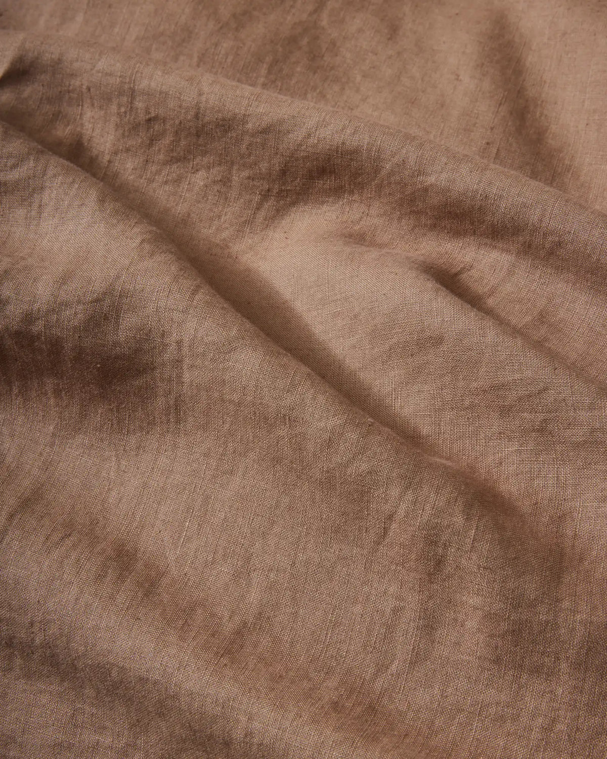 Ravello Fitted Sheet in Biscuit, close-up detail of soft European linen weave with relaxed, lived-in texture by Weave Home