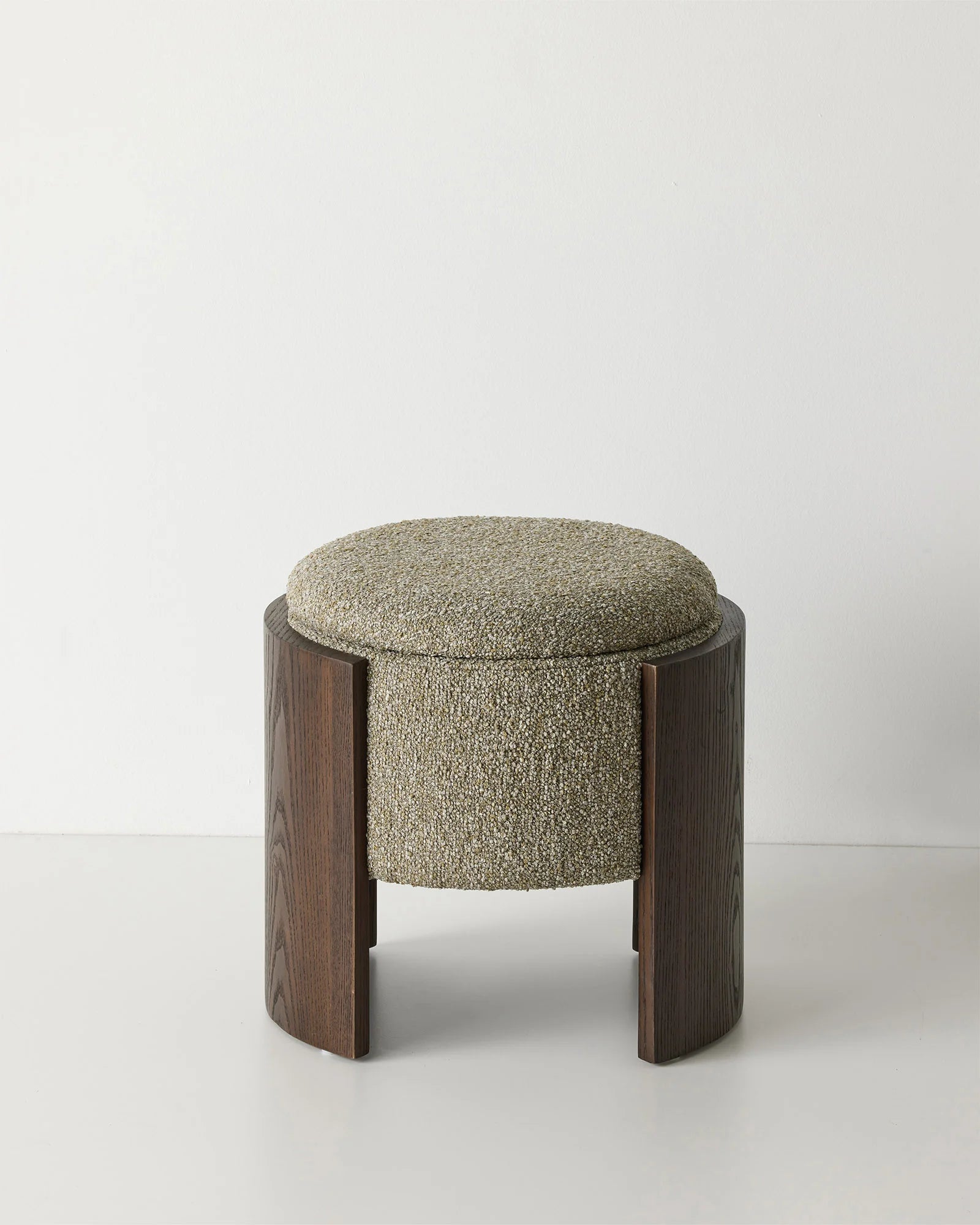 Norcia Moss ottoman with textured bouclé upholstery and dark walnut wood legs, front view by Weave Home