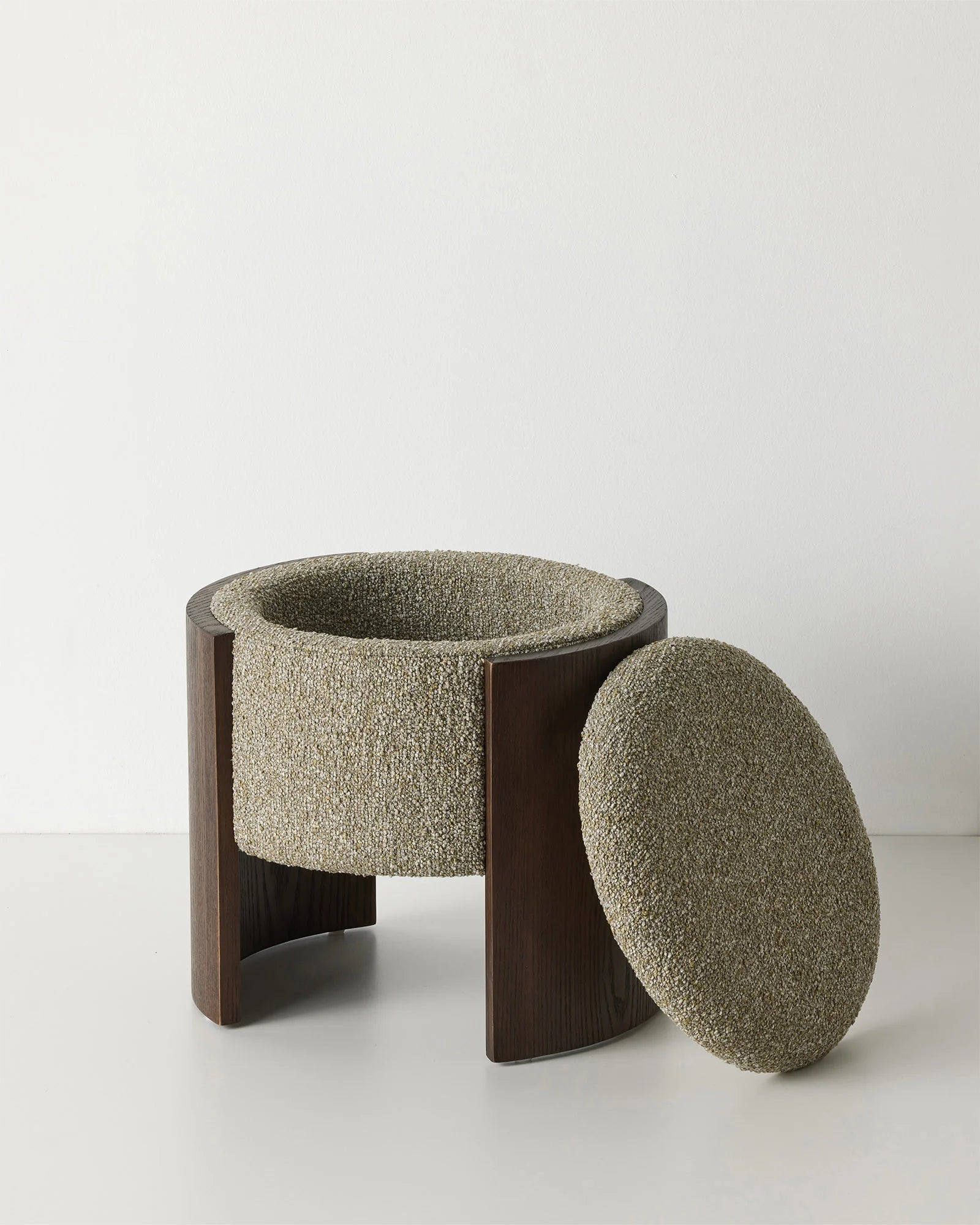 Norcia Moss ottoman with textured bouclé upholstery in moss, grey and white tones, dark walnut ashwood legs and removable lid by Weave Home