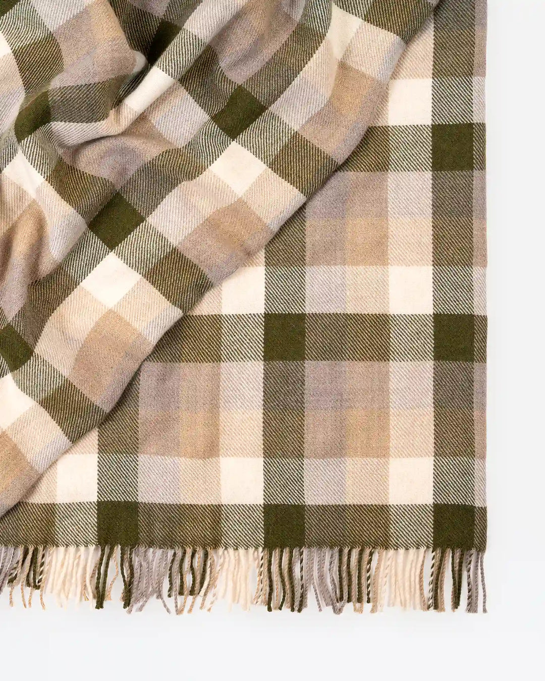 Caldwell Landscape throw detail shot showing twill weave plaid pattern in taupe, moss green, white and mushroom with fringe border by Weave Home