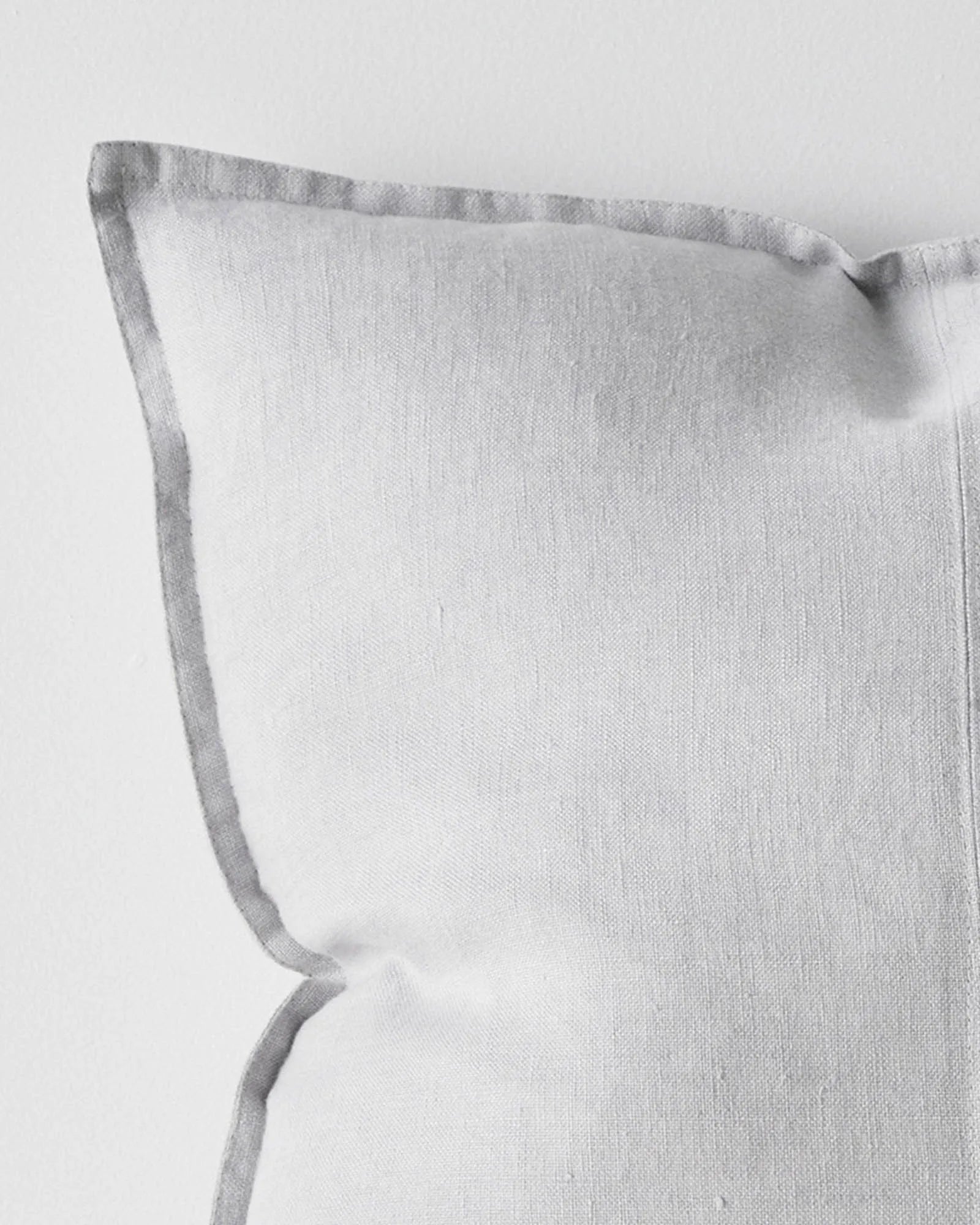 Como Silver linen cushion detail, showing stonewashed European linen with contrast piping edge, by Weave Home