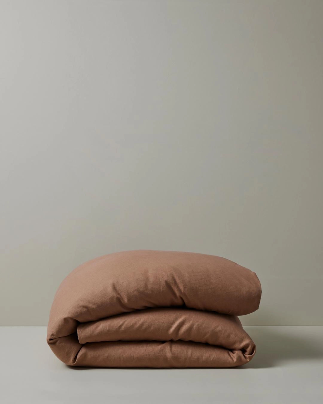 Ravello Quilt Cover in Biscuit, French Flax Linen, folded to show soft prewashed texture by Weave Home